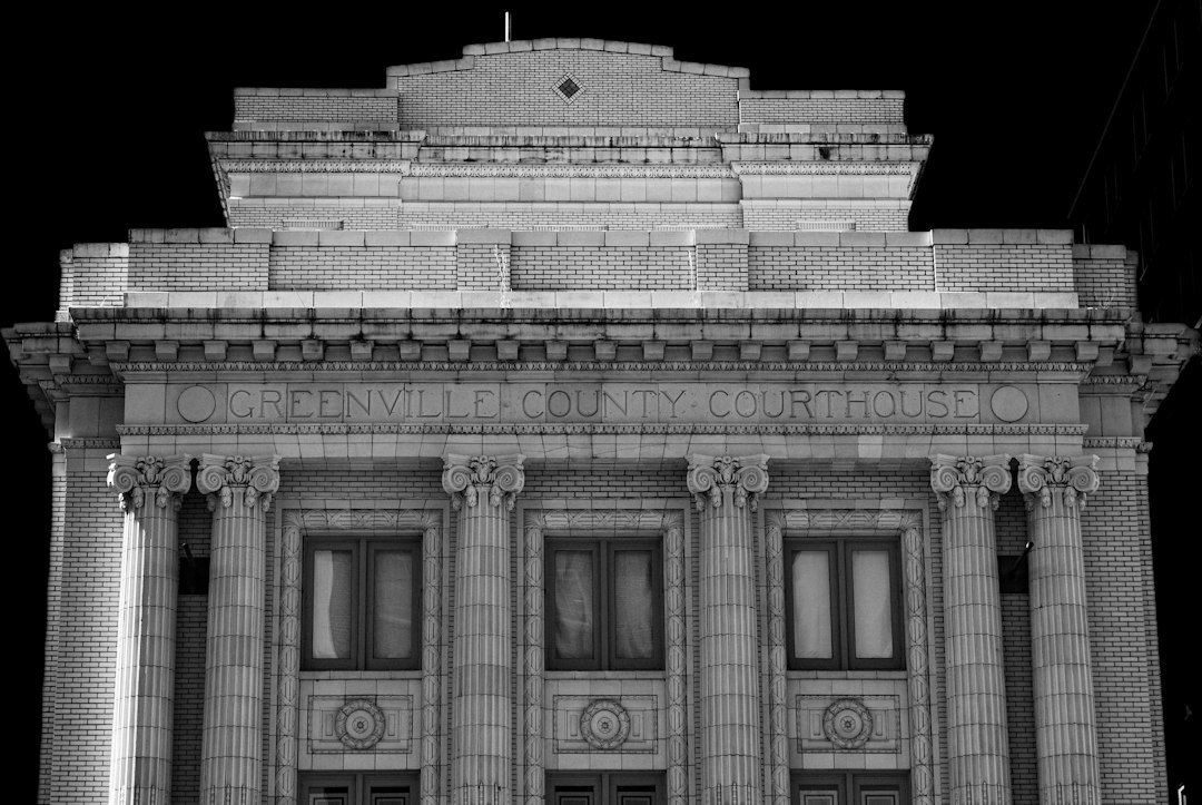 Classical courthouse facade with stone columns and tall windows