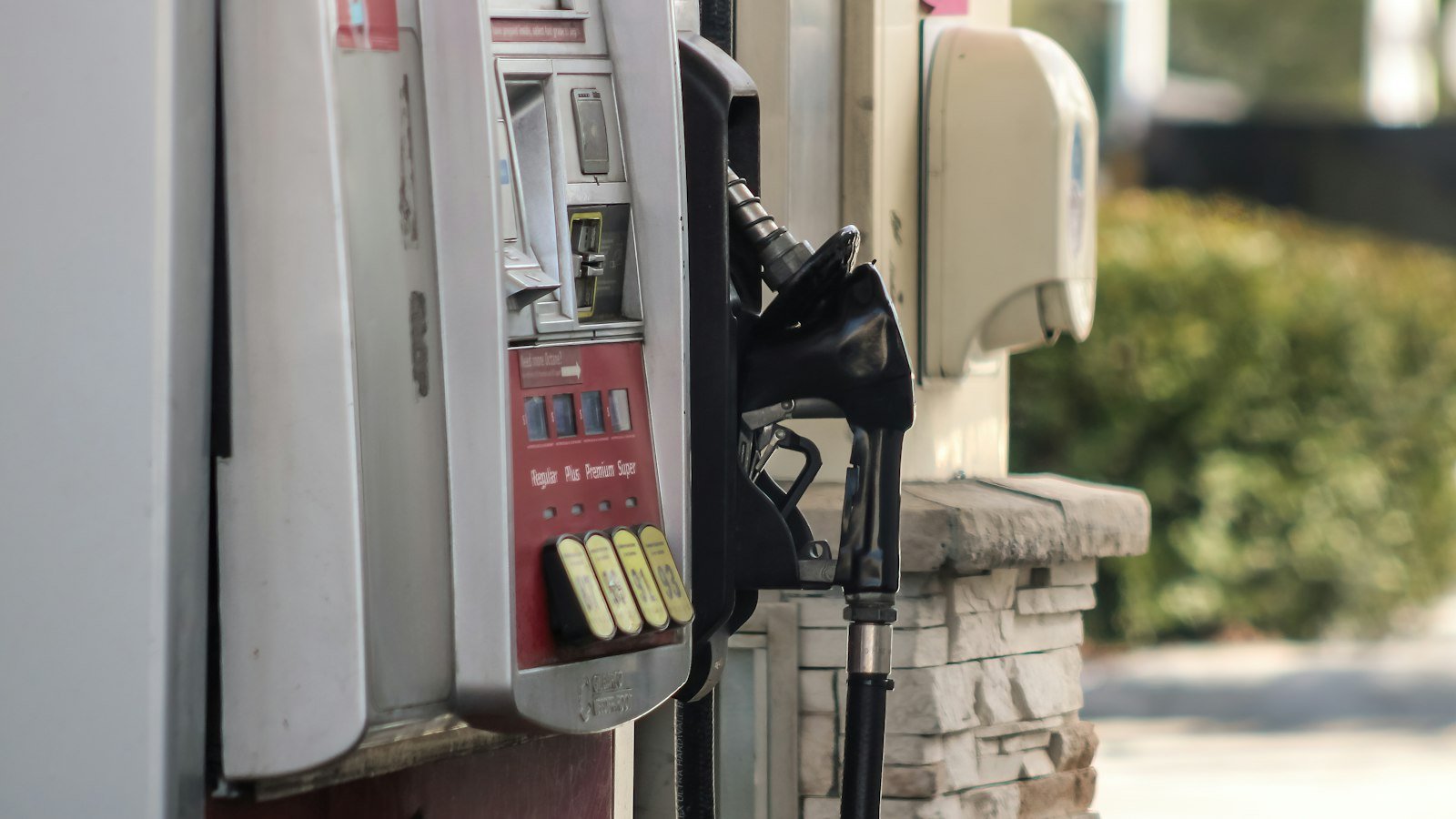 A gas pump next to a brick wall, as gasoline prices lifted US inflation in September
