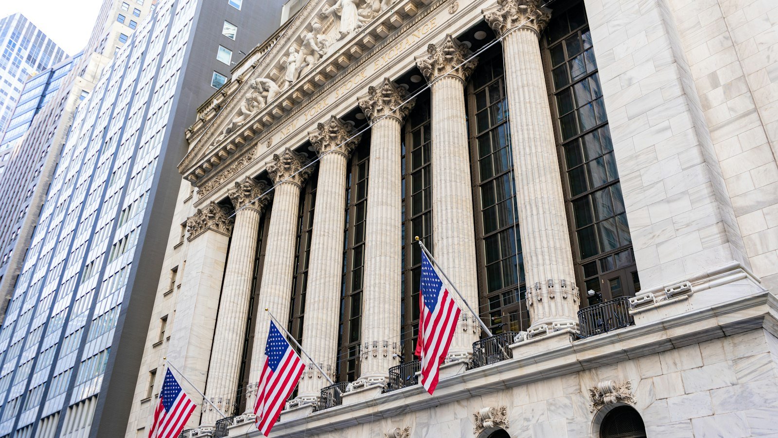 New York Stock Exchange building with American flags